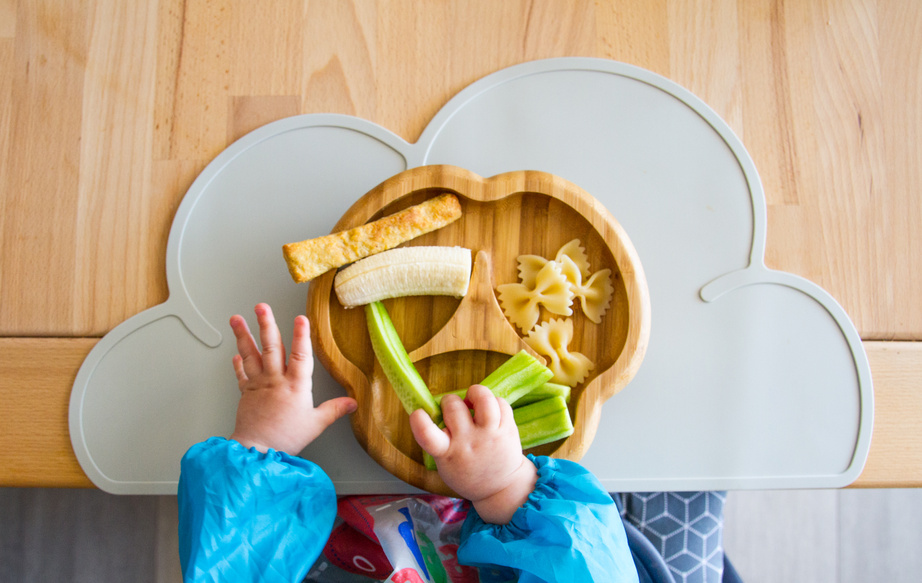 Baby nutrition BLW (baby-led weaning) with baby hands grabbing for food